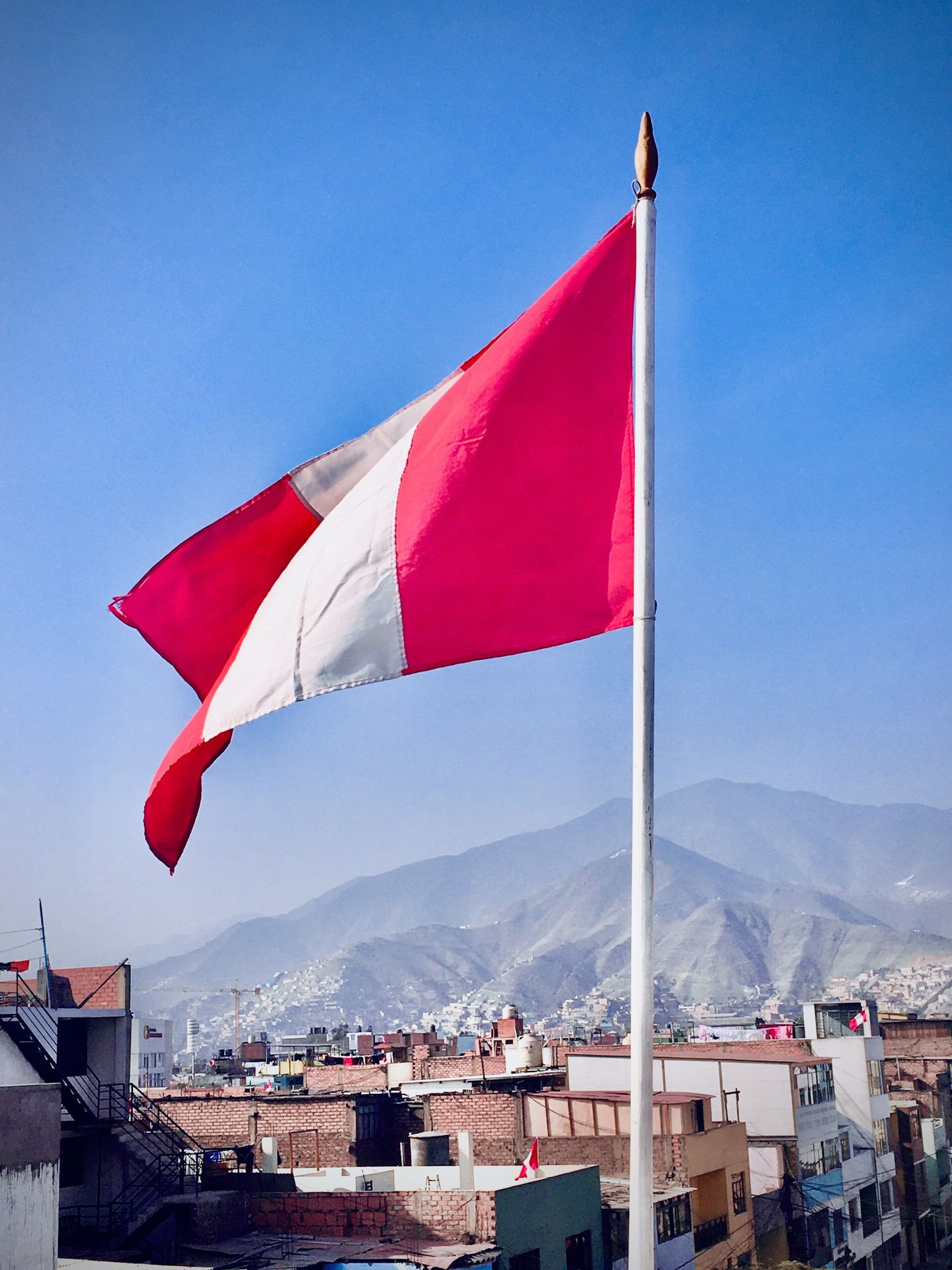 white red and blue flag on pole during daytime